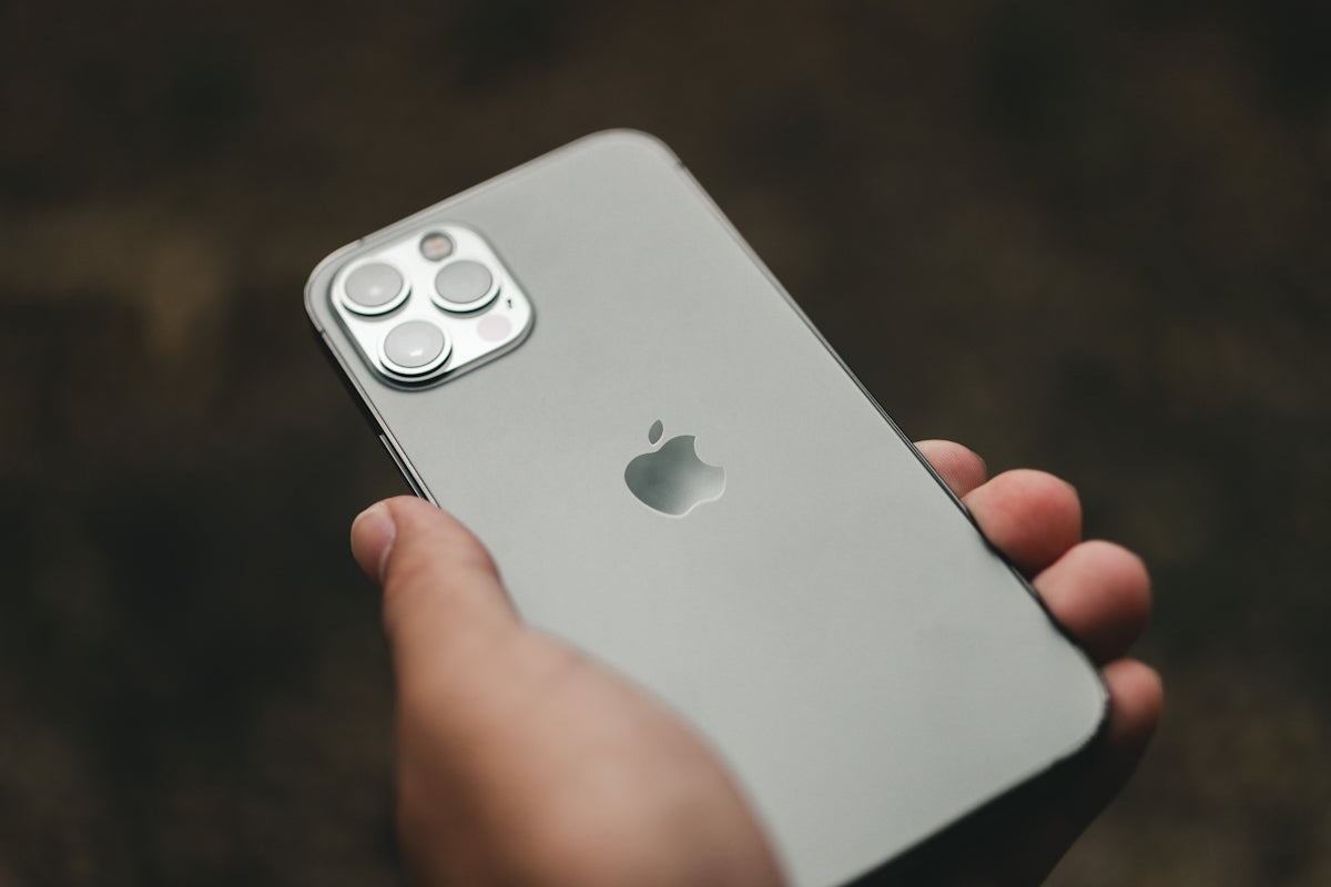 a person holding an iphone in their hand