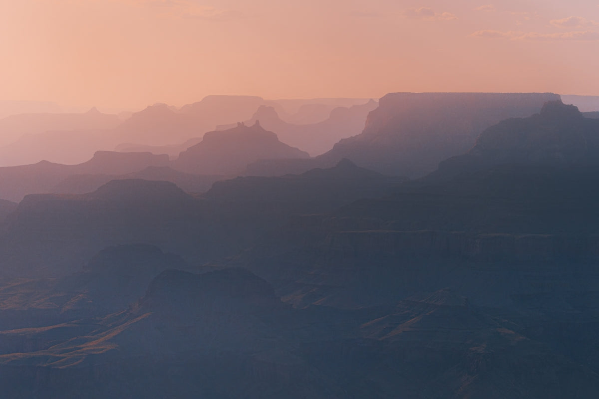 a view of a mountain range at sunset