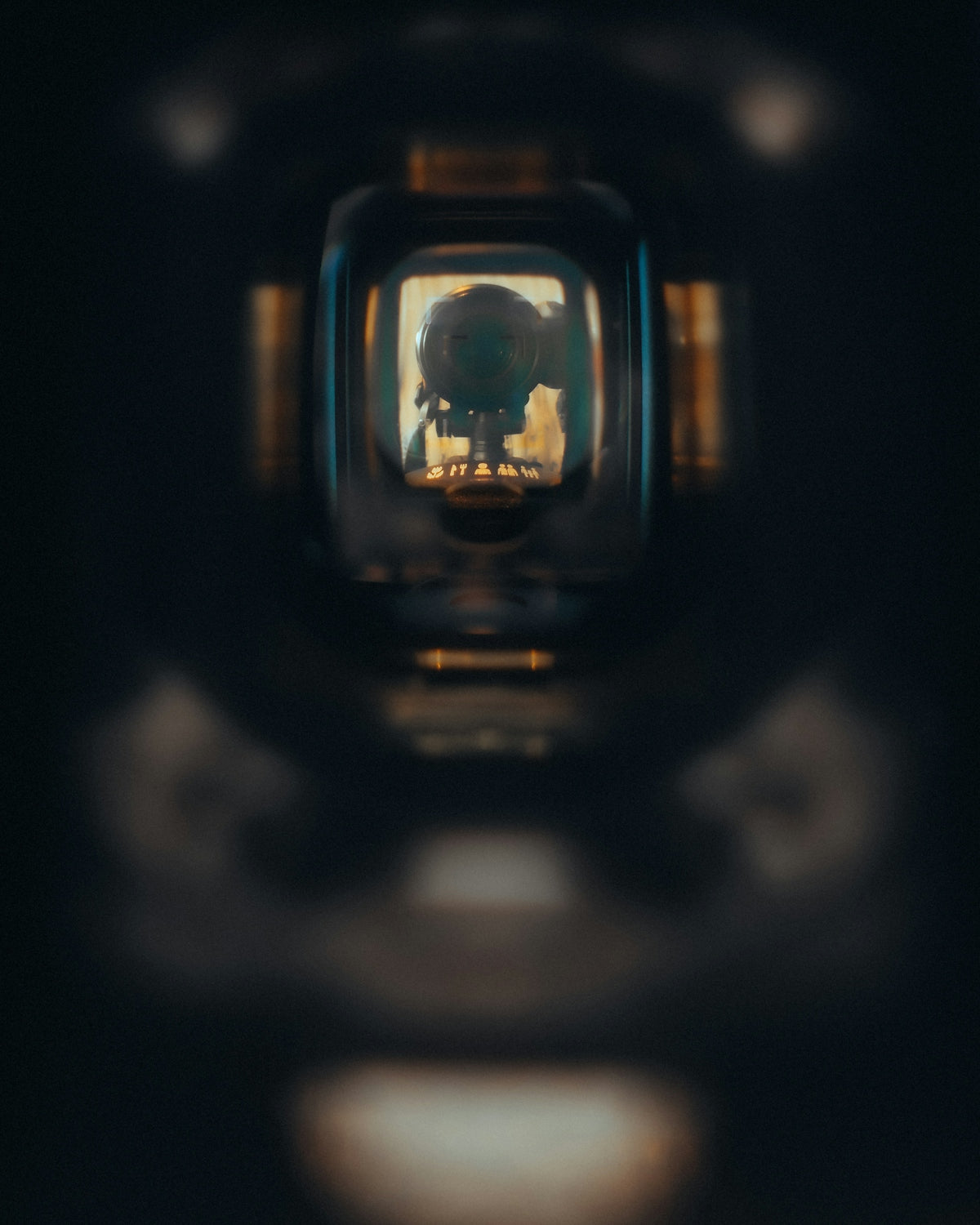 A skull reflected in a tiny, dark window.
