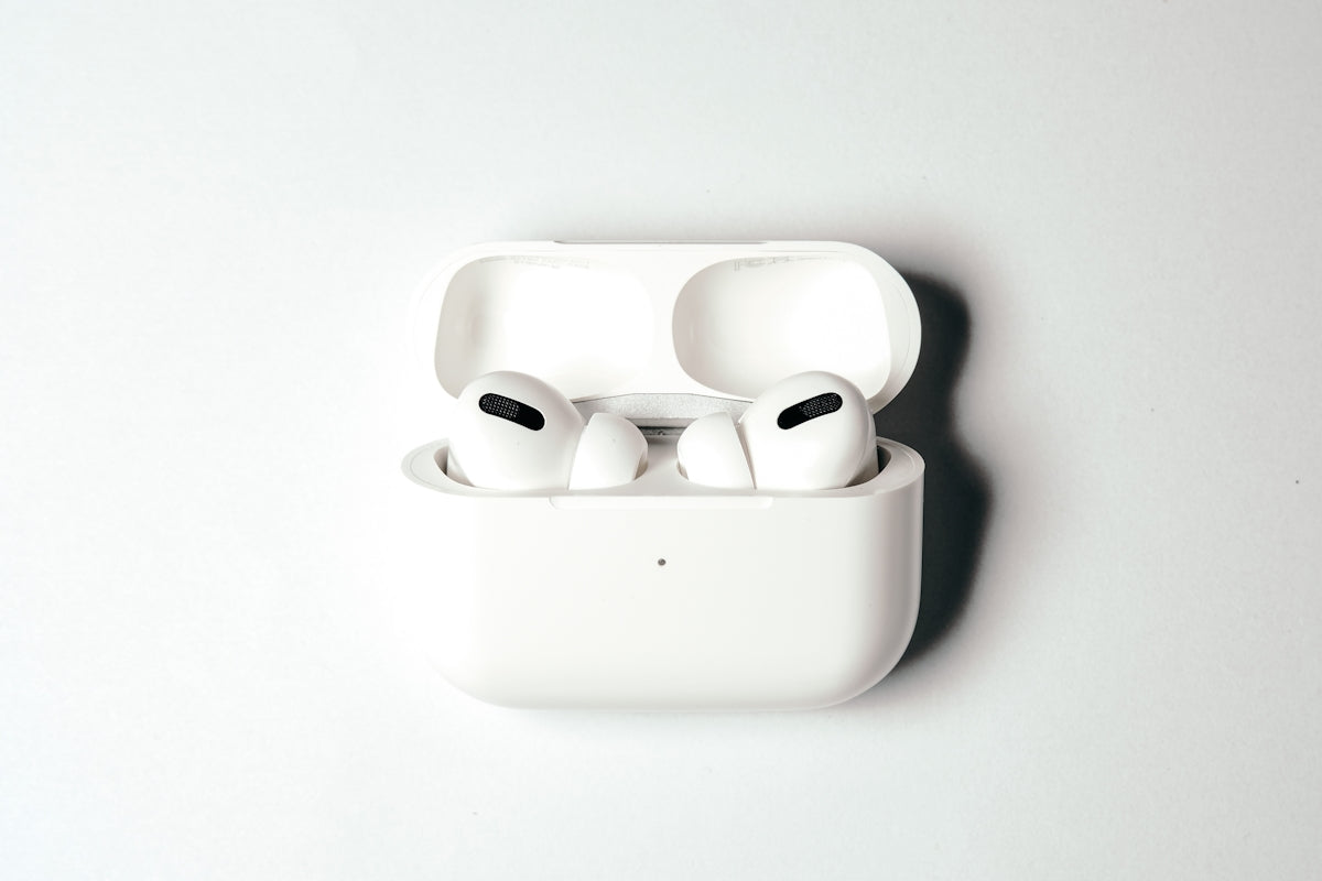 white apple earpods in white case
